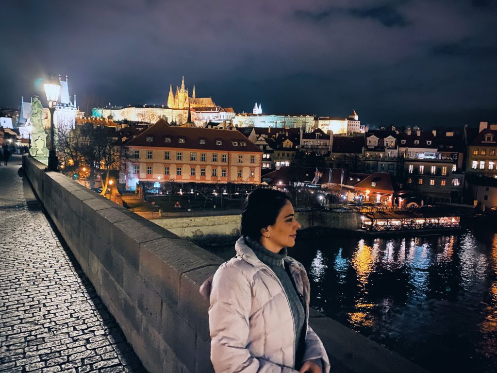 Romantic night walk across the Charles Bridge.